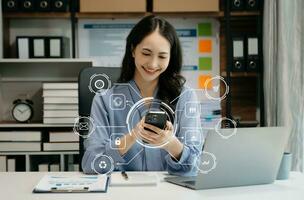 Digital marketing media in virtual screen.businesswoman hand working with mobile phone and modern compute with VR icon diagram at office photo