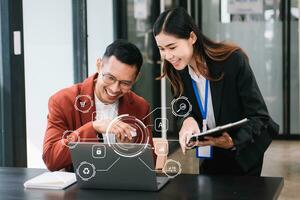 Business team partnership meeting concept. Business hand using laptop, tablet and smartphone  at office. in virtual icon screen photo