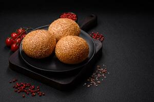 Delicious fresh crispy white round bread with seeds and grains photo