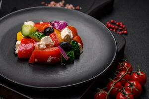 Delicious juicy Greek salad with feta cheese, olives, cucumber and tomatoes photo