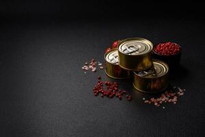 Round metal can with canned fish or meat with a key photo