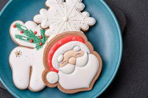 Beautiful Christmas gingerbread cookies on a round ceramic plate photo