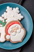 Beautiful Christmas gingerbread cookies on a round ceramic plate photo