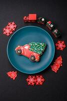 Ceramic round plate decorated with festive elements on the Christmas table photo