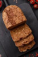 Delicious fresh crispy brown bread with seeds and grains photo