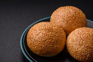 Delicious fresh crispy white round bread with seeds and grains photo