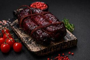 Delicious black blood sausage or black pudding with spices and herbs photo