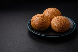 Delicious fresh crispy white round bread with seeds and grains photo