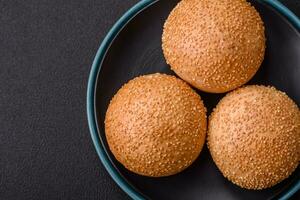 Delicious fresh crispy white round bread with seeds and grains photo