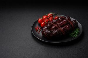 Delicious black blood sausage or black pudding with spices and herbs photo