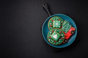 Beautiful Christmas gingerbread cookies on a round ceramic plate photo