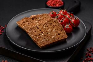Delicious fresh crispy brown bread with seeds and grains photo