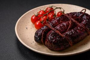 Delicious black blood sausage or black pudding with spices and herbs photo