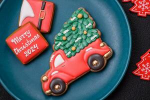 Ceramic round plate decorated with festive elements on the Christmas table photo