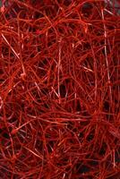 Red thin hot chili threads on a dark background photo