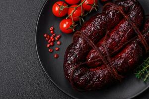 Delicious black blood sausage or black pudding with spices and herbs photo