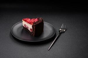 Beautiful tasty sweet slice of cheesecake with cherry on a ceramic plate photo