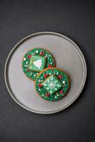 Beautiful festive Christmas gingerbread made by hand with decoration elements photo