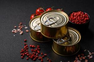 Round metal can with canned fish or meat with a key photo