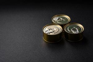 Round metal can with canned fish or meat with a key photo