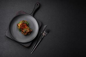 Delicious juicy fried chicken in teriyaki sauce with salt, spices, herbs and sesame seeds photo