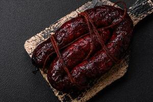 Delicious black blood sausage or black pudding with spices and herbs photo