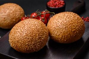 Delicious fresh crispy white round bread with seeds and grains photo