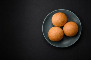 Delicious fresh crispy white round bread with seeds and grains photo