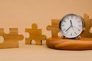 Clock and jigsaw puzzle pieces. Time lapse time. Wooden jigsaw puzzle pieces. communication teamwork key components photo