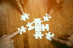 Jigsaw combines the energy of teamwork. The importance of working as a team Join groups to work and complete successful errands. Pieces Keywords in Great Teamwork photo