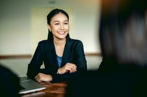 young business woman working intently and have a bright smile Meeting of the work plan financial planner finance staff happy work Financial and investment planner photo