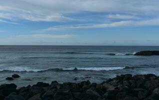 Waves Rolling Up to Lava Rocks on the Shore of Sao Miguel photo