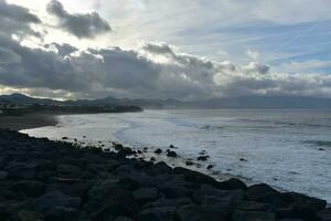 Dusk on the Beach of Ribeira Grande in the Azores photo