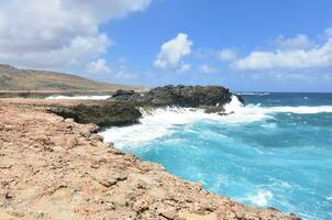 Crashing Ocean Waves on Aruba's Rocky Eastern Coast photo