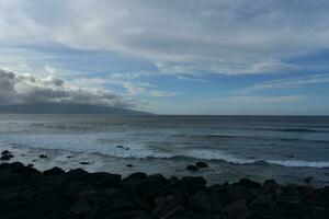 Low Clouds Over the Hills and Ocean of Sao Miguel photo