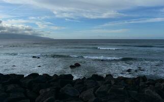 Waves Rolling Ashore in Ribeira Grande in the Azores photo