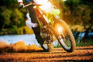 man riding enduro motorcycle on dirt field photo