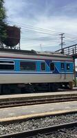 blue train on steel tracks transportation system photo