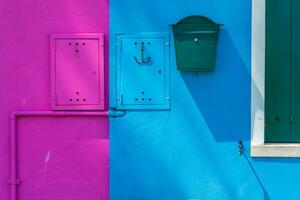 View of the colorful Venetian houses at the Islands of Burano in Venice photo