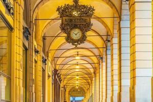 Arcades in the center of old town Bologna Italy photo