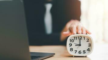 clock on businessman hand, time management concept,effective business planning,time management in the organization,Agreement and solution,end of the deal ,profitable use of time photo