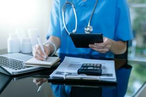 Medicine doctor hand working with modern digital tablet computer interface as medical network concept photo