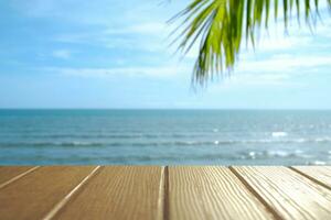 Beautiful foreground wooden floor and blue sea and sky background. photo