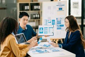 UX developer and ui designer brainstorming about mobile app interface wireframe design with customer breif and color code photo