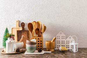 Beautiful festive Christmas kitchen background with decor elements on kitchen stone countertop. A copy space. photo