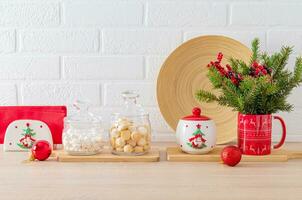 Christmas decorations and Christmas utensils on kitchen countertop in modern interior before holiday. Beautiful Christmas background. photo