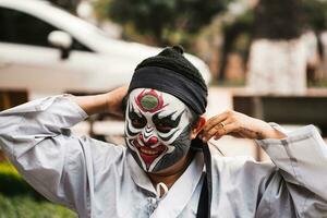 Ho Chi Minh City, Vietnam - August 19, 2023 Artists performing Vietnamese classical opera make up for the show in Binh Thanh District photo