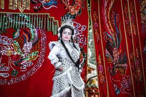 Ho Chi Minh City, Vietnam - August 19, 2023 Artists performing Vietnamese classical opera as know as Hat Boi in Binh Thanh District photo