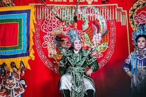 Ho Chi Minh City, Vietnam - August 19, 2023 Artists performing Vietnamese classical opera as know as Hat Boi in Binh Thanh District photo
