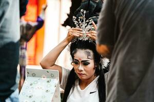 Ho Chi Minh City, Vietnam - August 19, 2023 Artists performing Vietnamese classical opera make up for the show in Binh Thanh District photo